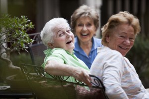 Two older adults with daughter enjoying time together in Naples, Florida